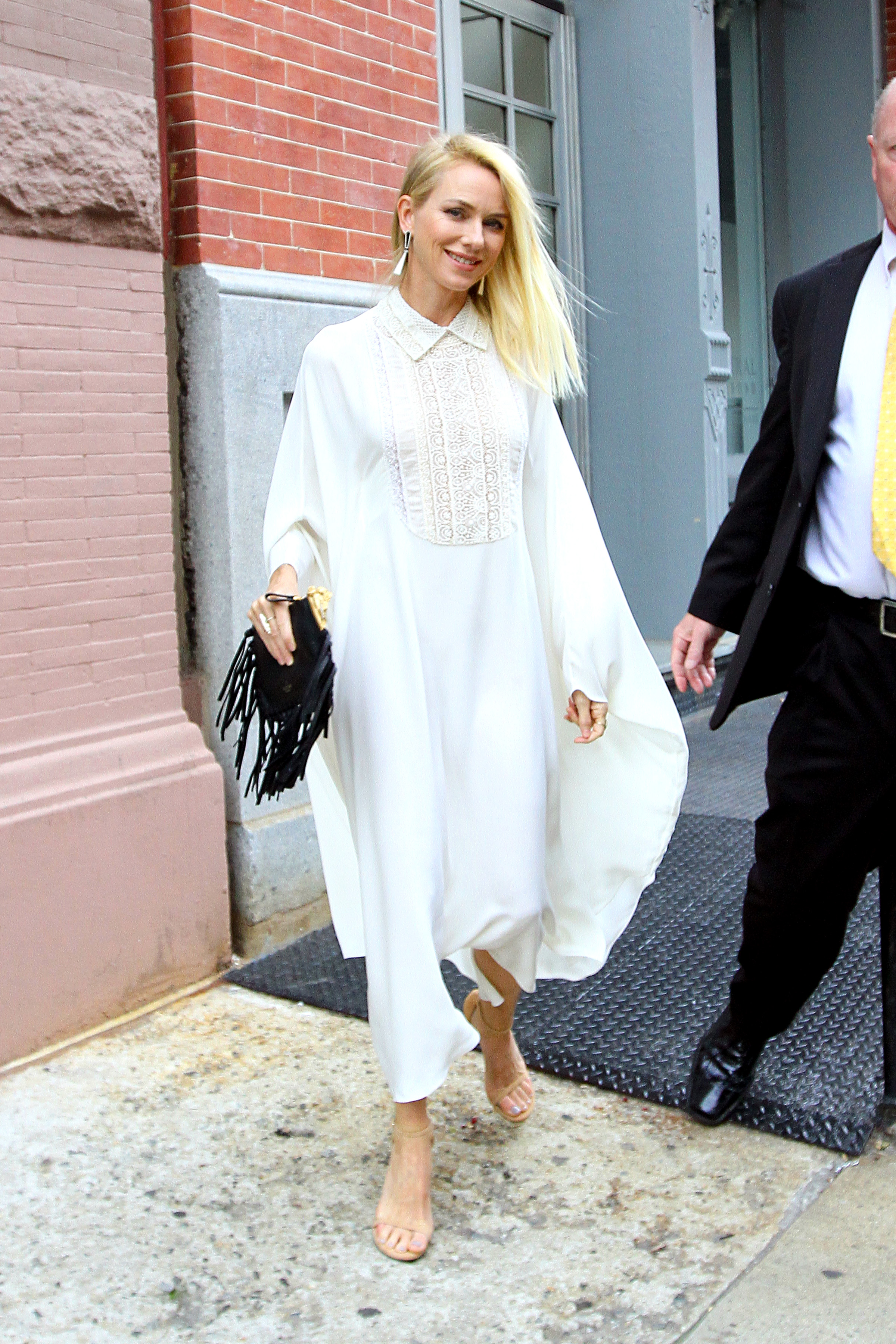 Naomi Watts looks glamorous in a white gown as she heads to celebrate her birthday in NYC