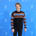 Do You Need To See Willem Dafoe Being Expressive With a Huge Mustache and a Lively Sweater?