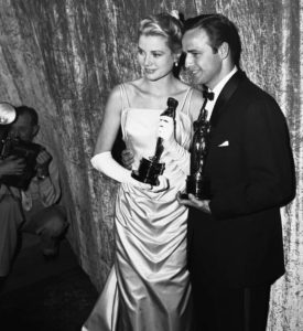 Grace Kelly and Marlon Brando with Oscar Awards
