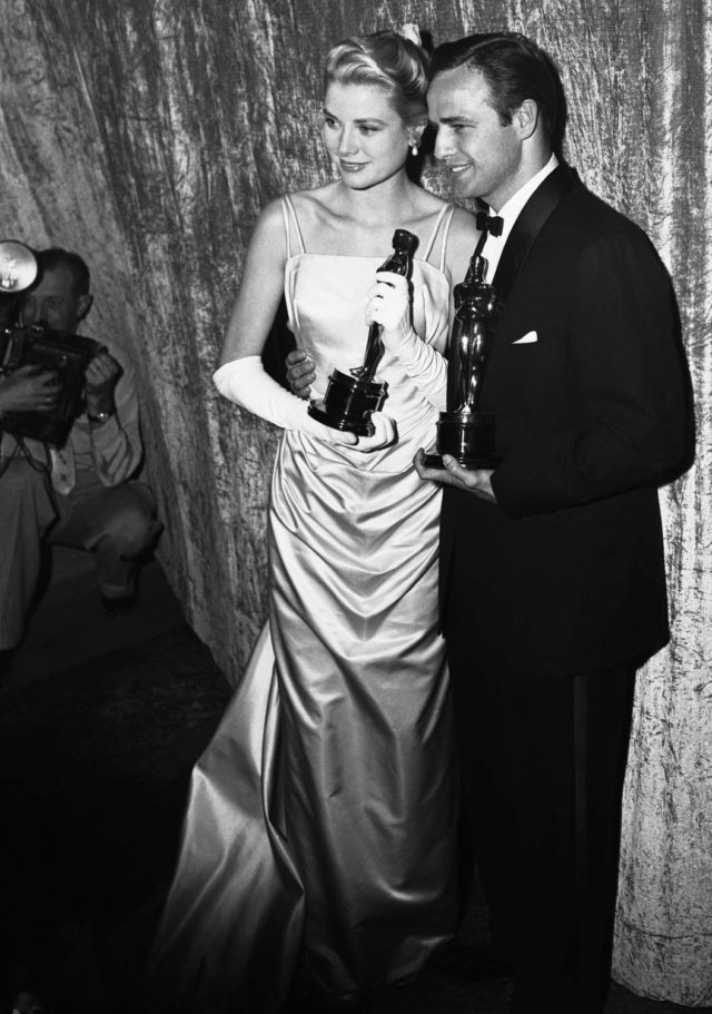 Grace Kelly and Marlon Brando with Oscar Awards