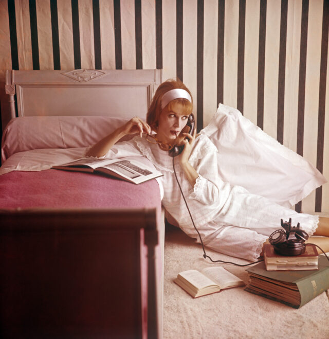 A girl in pyjamas at the telephone