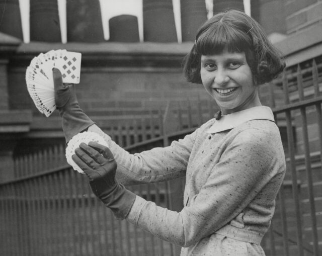 Schoolgirl Magician Daphne Barnett Demonstrating A Card Trick. Box 671 408031626 A.jpg.
