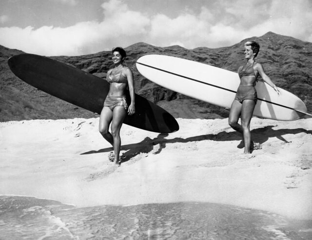 Young Women Holding Surfboard. 1960