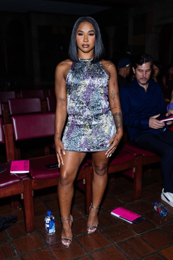 jordan chiles wore a shirt-dress and thigh-high boots Jordan Chiles Skipped the Pants With a Fall Dress Hack at Lakers Game See Photos
