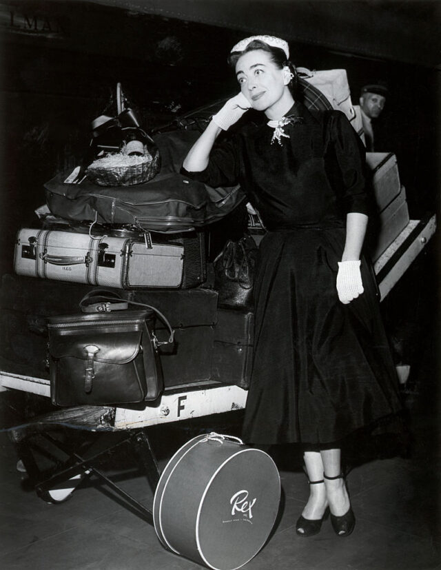 Joan Crawford Stands W/ Lots Of Luggage