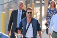 Glen Powell Looks Casually Good Carrying His Dog Around